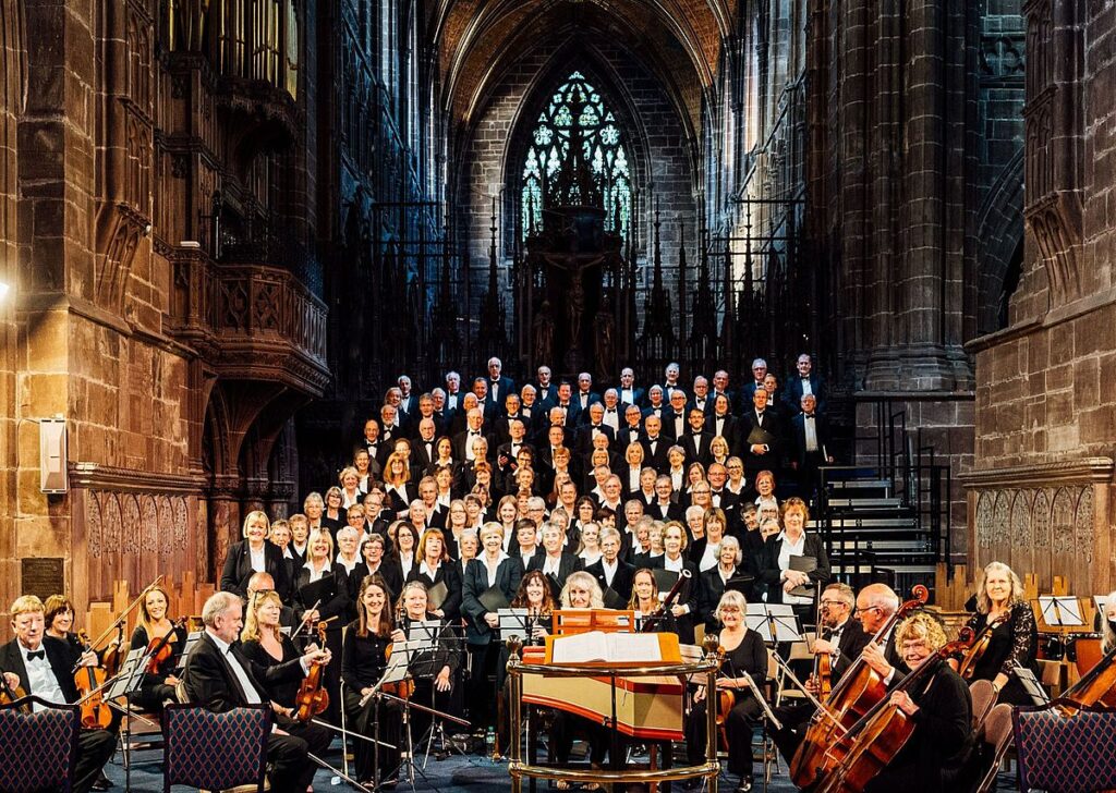 Shows Chester Music Society choir performing in Chester Cathedral